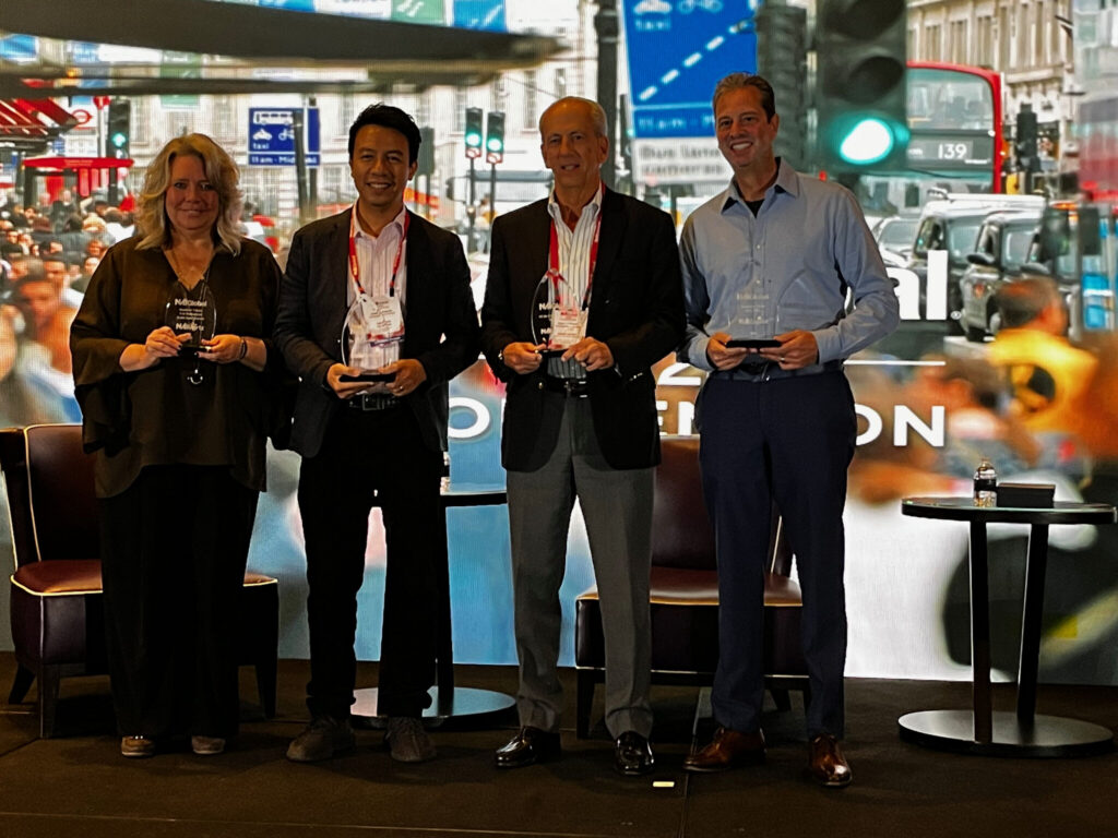 A picture of Carmen Facciolo, Jr., President of NAI Emory Hill, receiving the Of the Community award at the NAI Global Conference 2026.