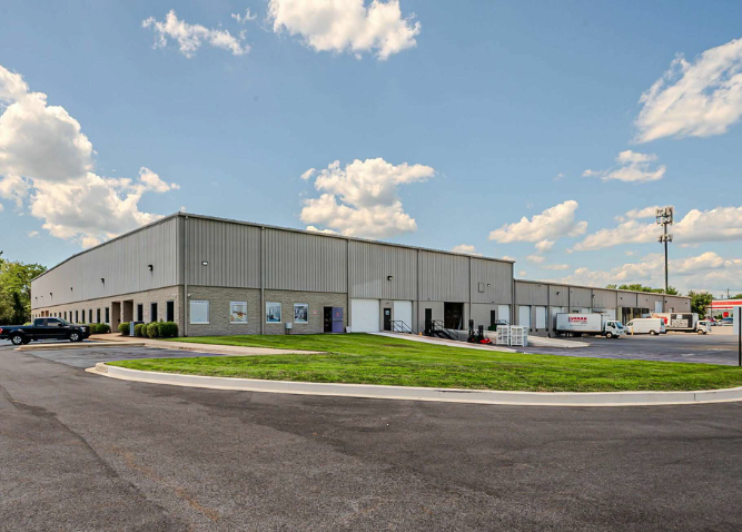 An exterior photo of the 2020 Firedancer Building showing the drive-in and dock doors