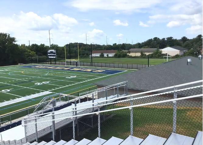 A picture of the athletic field and bleachers at Fusco Memorial Stadium