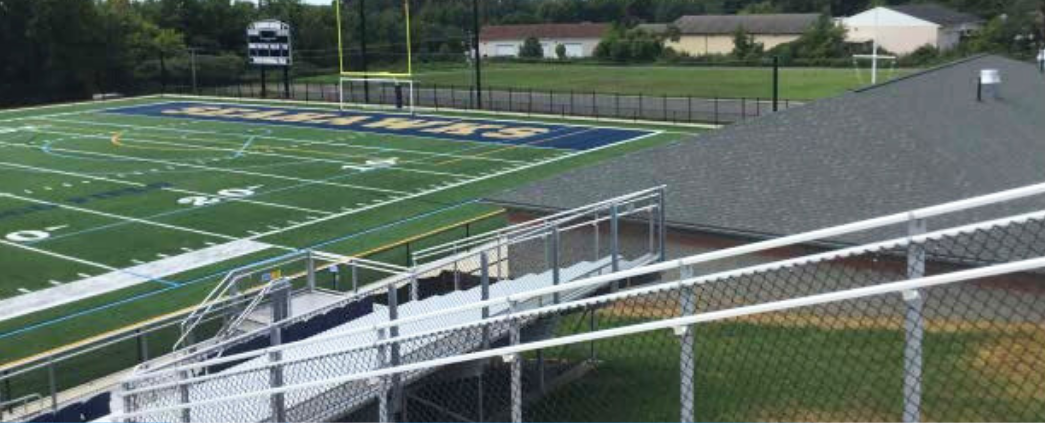 A picture of the athletic field and bleachers at Fusco Memorial Stadium
