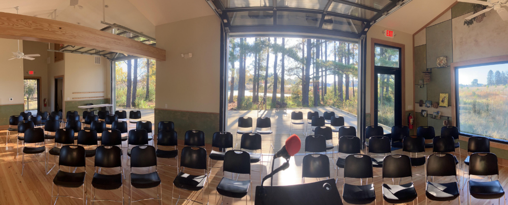 A photo of the interior of Harwood Nature Center, showing chairs lined up for a class