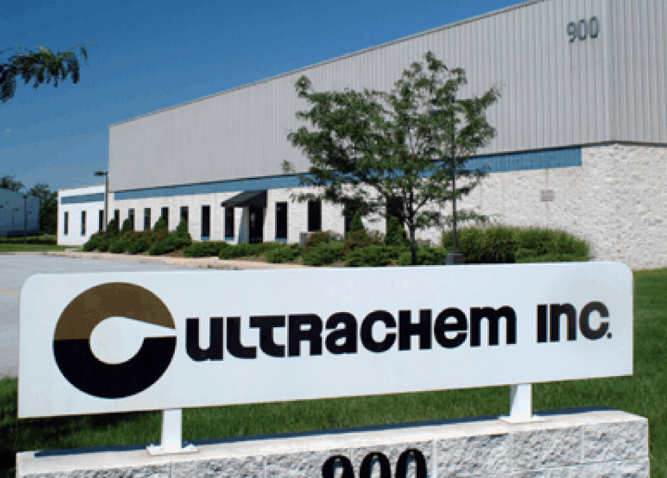 A picture of the Ultrachem sign with the building in the background